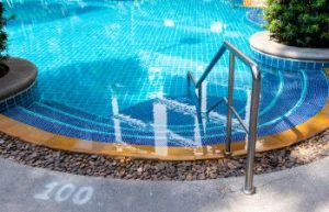 swimming pool in the backyard of a house