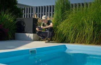 A technician servicing swimming pool pump